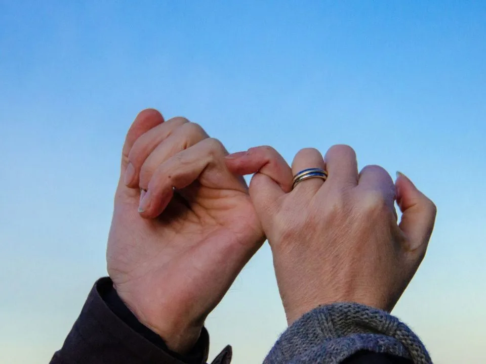 Closeup shot of hands, pinky promise