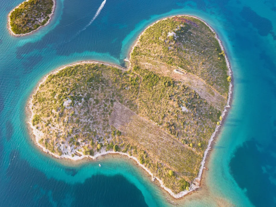 An aerial shot of a heart shaped island in Croatia