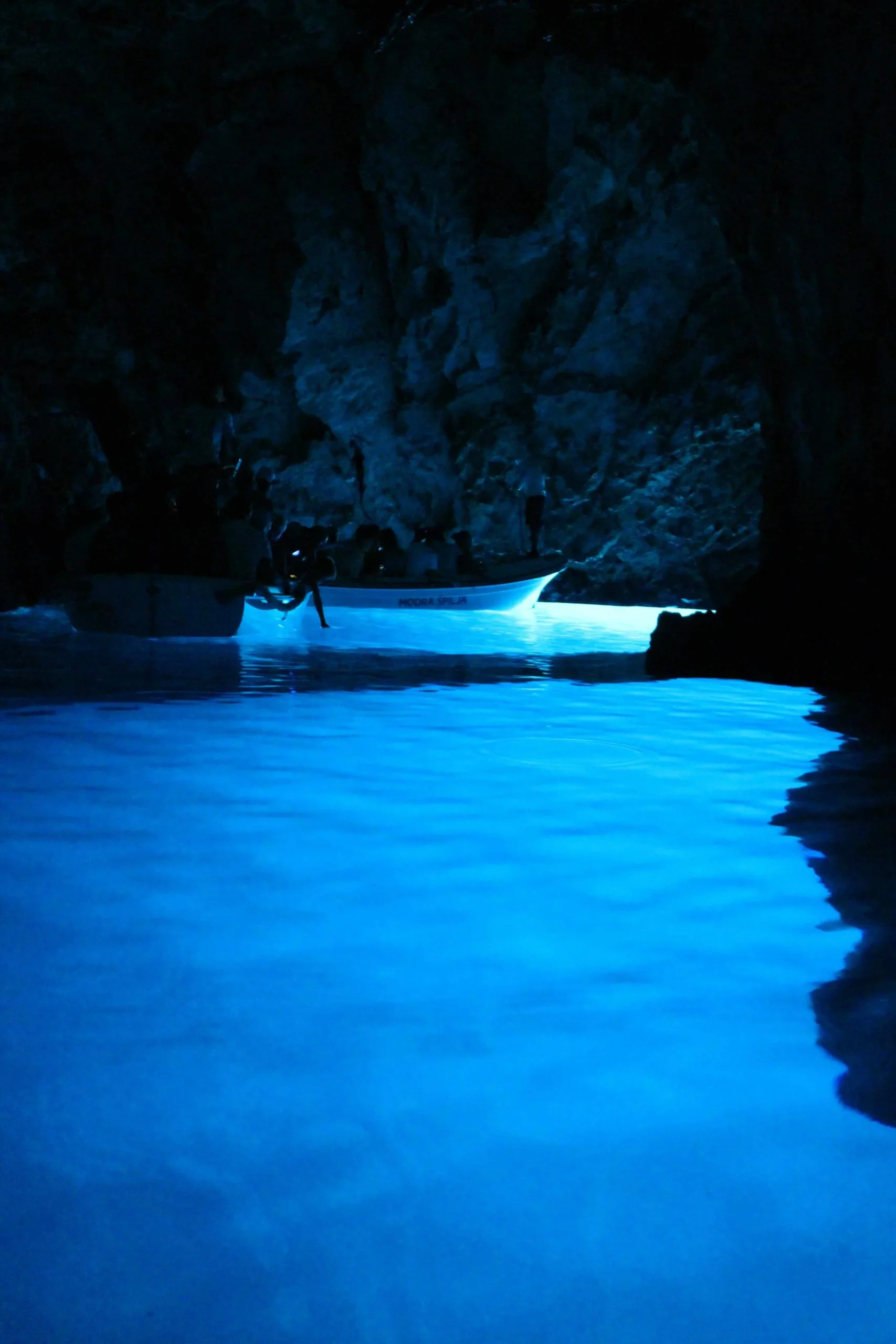 Low shot of cave illuminated by blue light