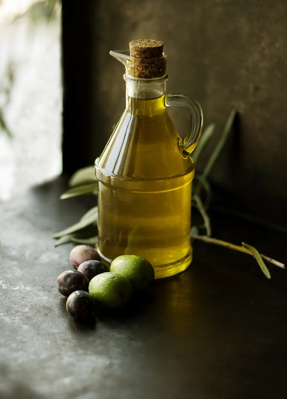 olive oil in the bottle,olives on the tabble