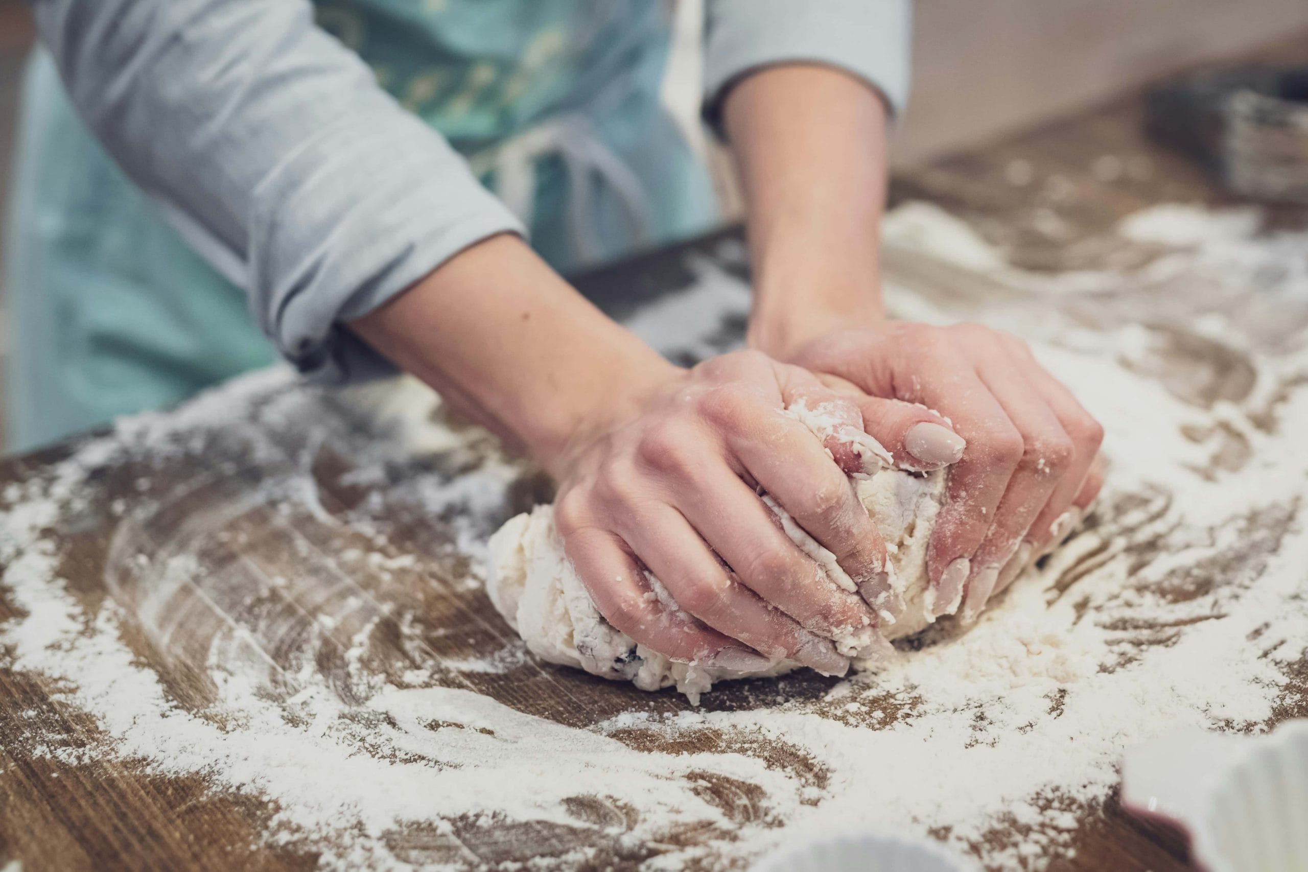 a man kneading the dough
