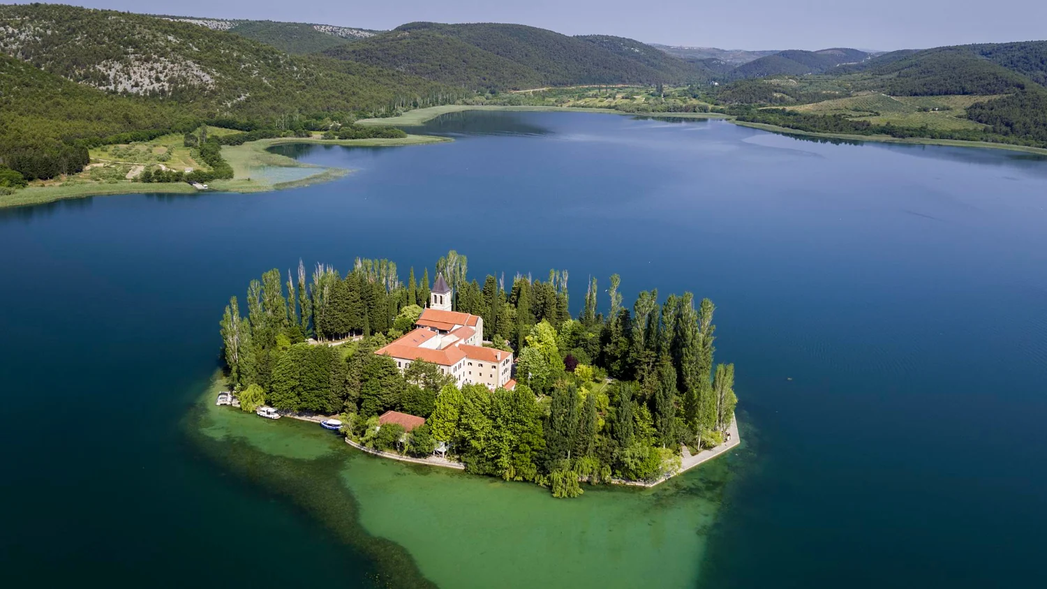 Visovac Island with a Franciscan monastery in the middle of Visovac Lake in Krka National Park