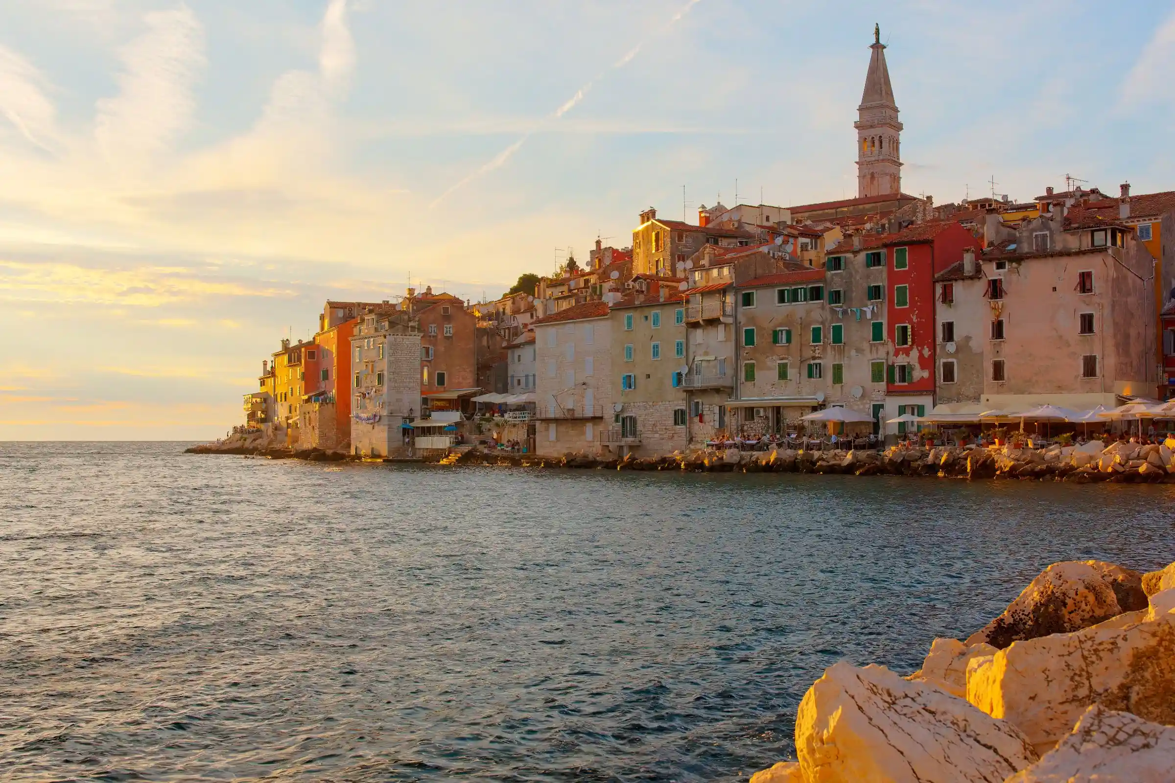 Things to do in Istria, Croatia – Rovinj old town and St Euphemia bell tower at sunset seen from the sea